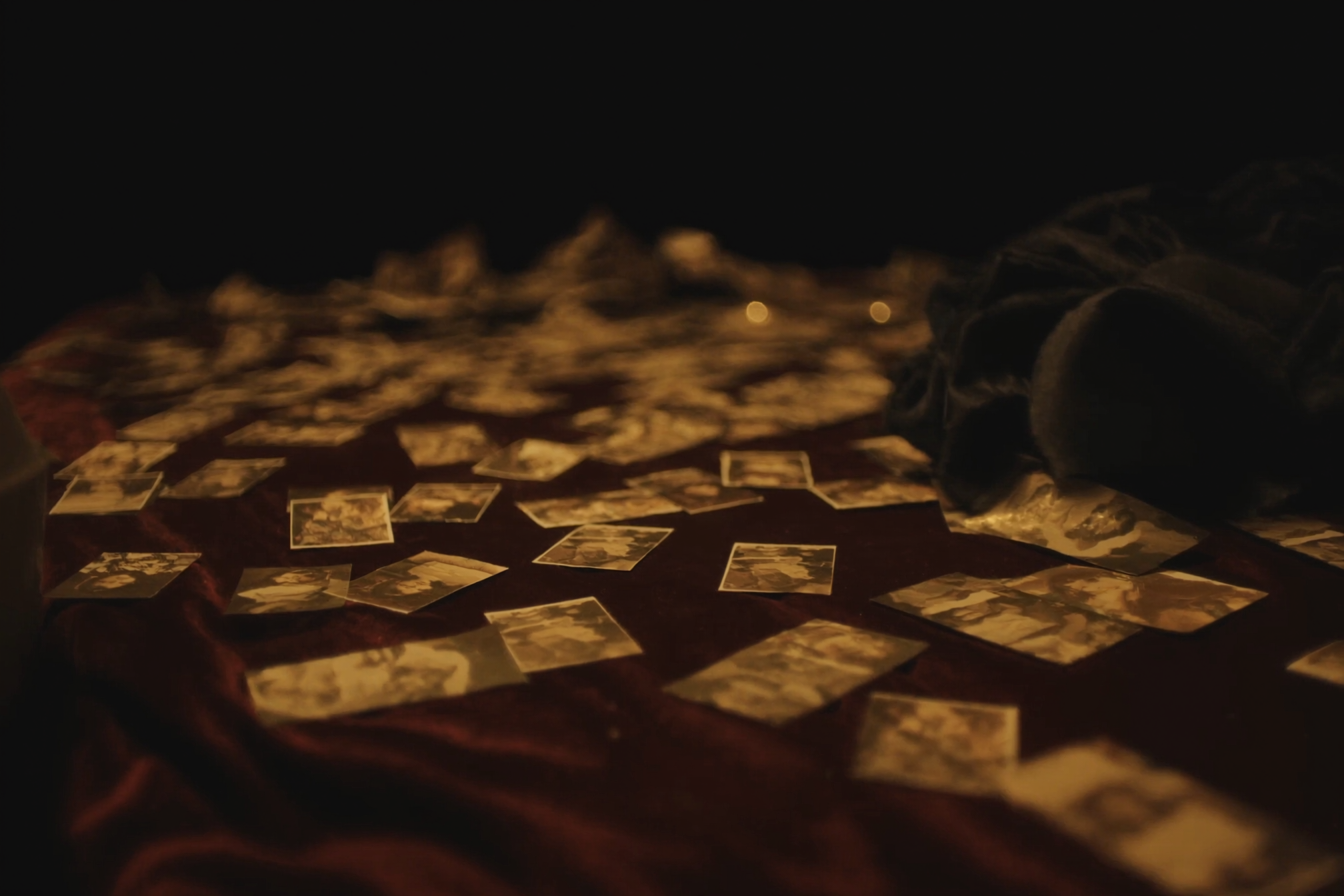 Printed photographs scattered on velvet